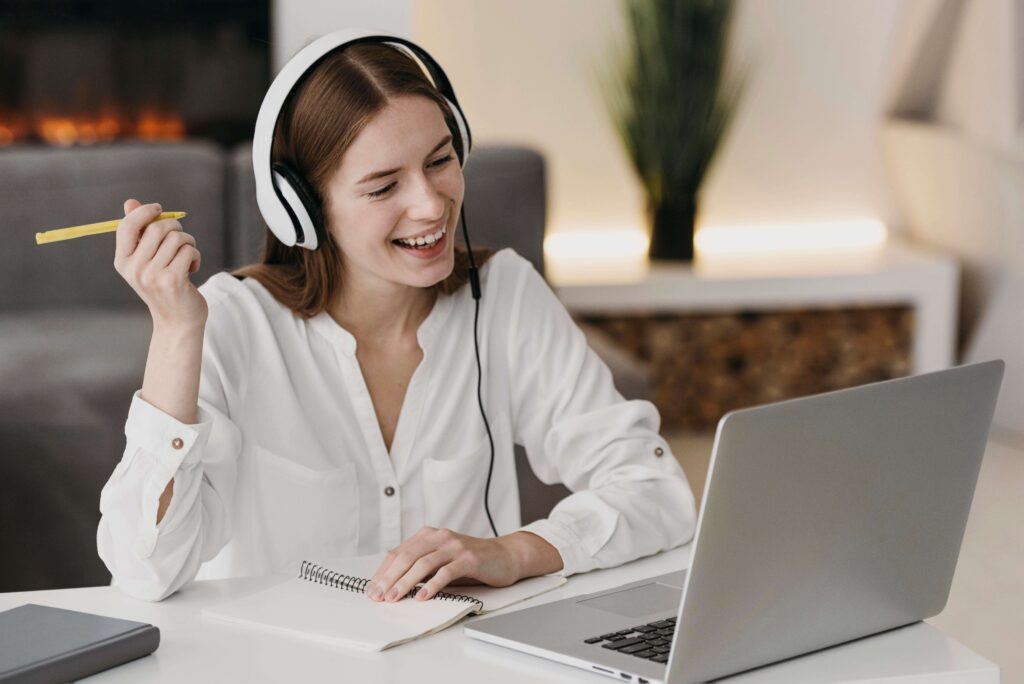 happy-teacher-talking-with-her-students-online